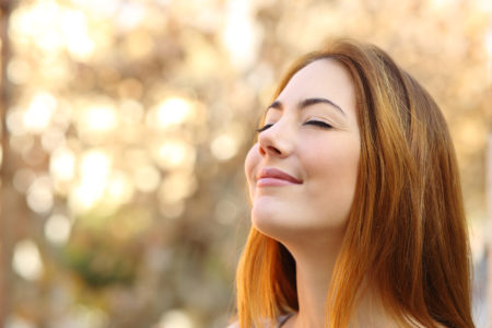 Beautiful woman doing breath exercises with an autumn background – Sam ...